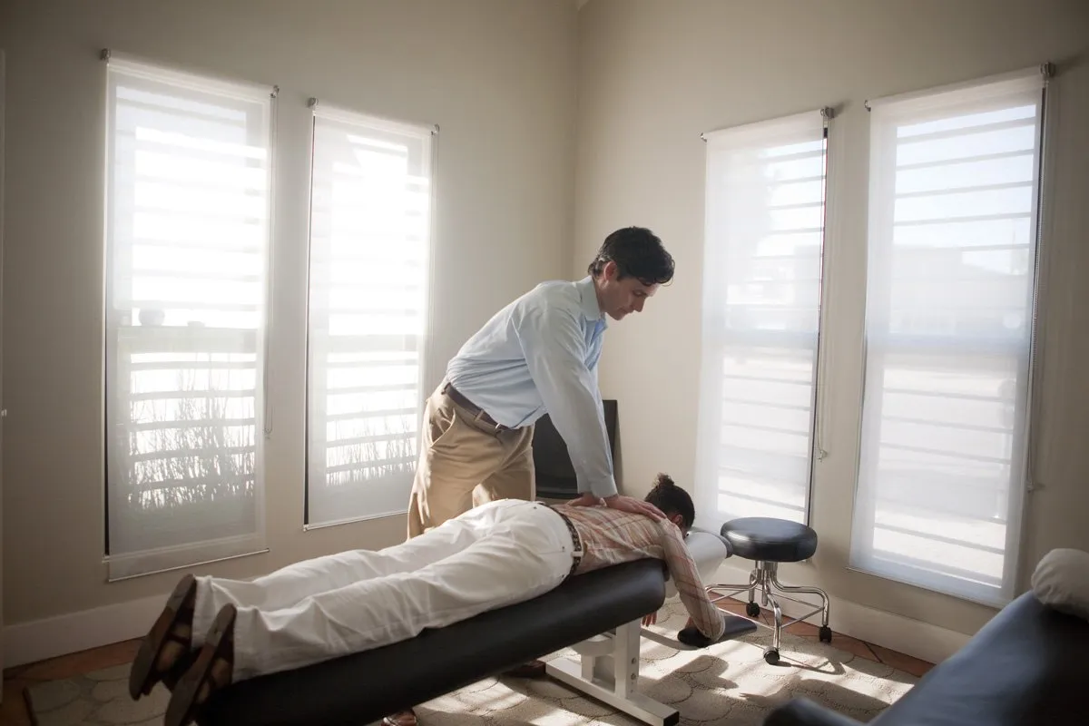Dr. Matthew Gloin providing chiropractic care to a patient