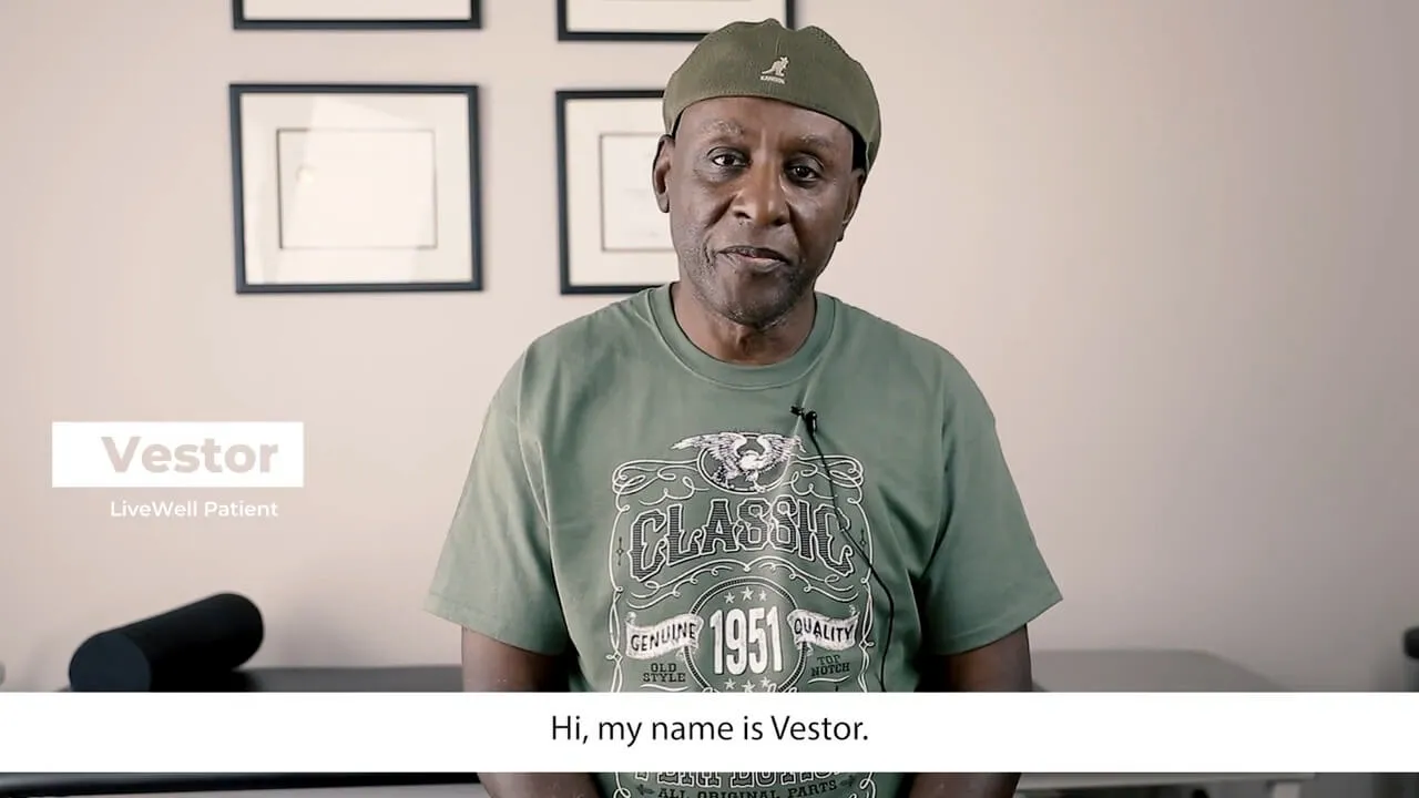 Vestor, a Live Well Chiropractic patient, seated in the treatment room