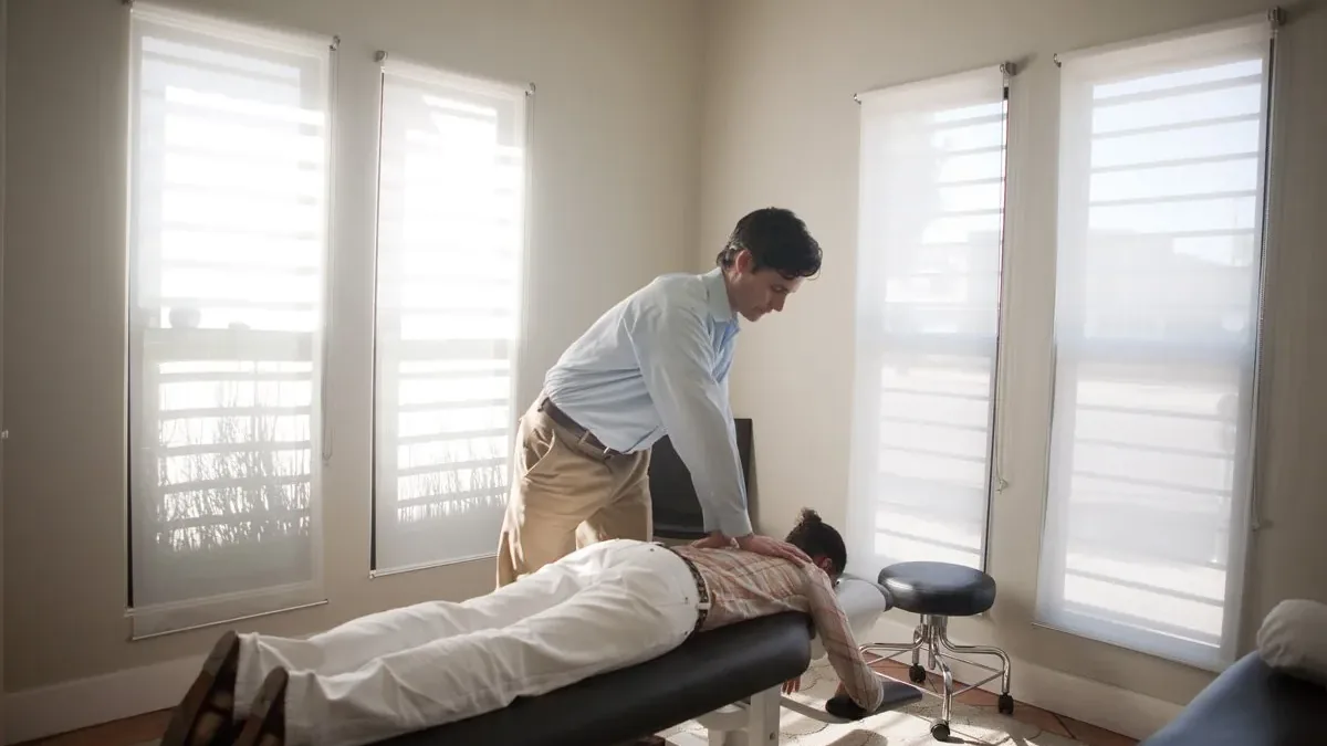 Dr. Matthew Gloin, D.C. providing chiropractic care to a patient at Live Well in Los Angeles